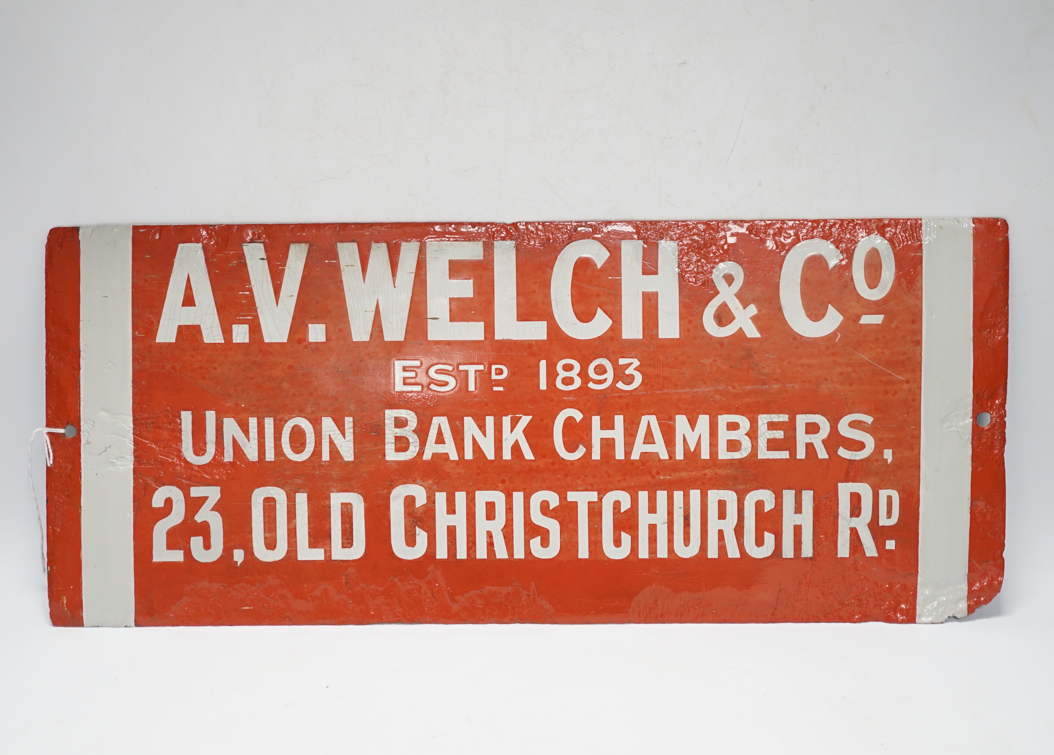 An enamel advertising sign: A.V. Welch & Co, and an Eastport Lane aluminium street sign, latter 105cm long